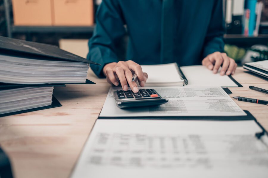 Man using a calculator