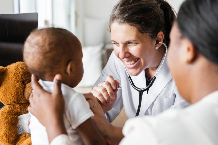 Doctor treating infant patient